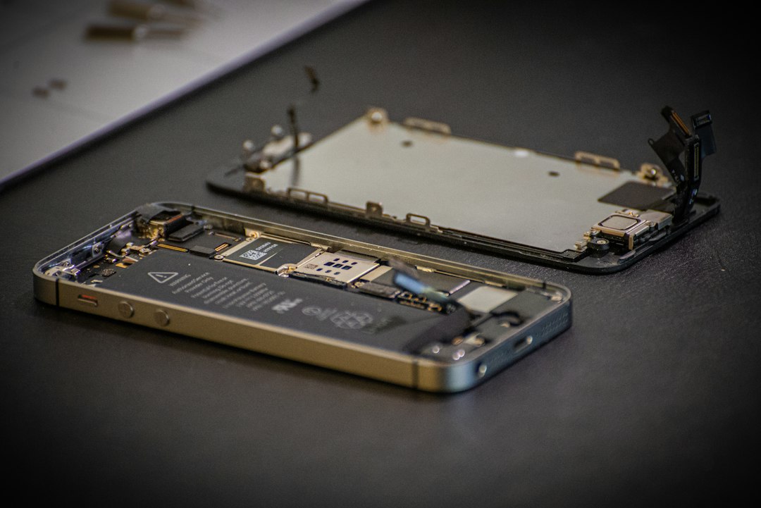 Smartphone repair workbench with tools and phone components